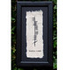 Framed parchment artwork featuring vertical Ogham script for ‘Misneach,’ the ancient Irish word for ‘Courage,’ with rough-edged paper and black frame, set against a leafy green background. Framed parchment artwork featuring vertical Ogham script for ‘Misneach,’ the ancient Irish word for ‘Courage,’ with rough-edged paper and black frame, set against a leafy green background.